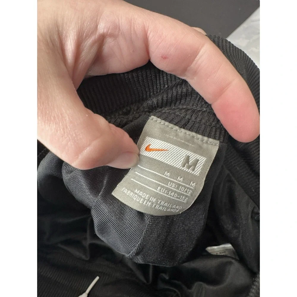 Nike girl M mesh lined snap side back logo flare pants athletic Y2K 90s preppy